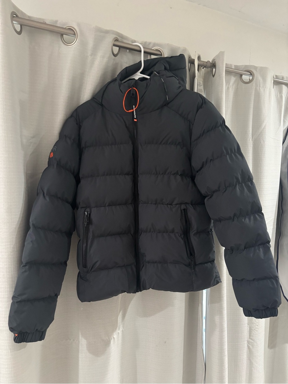 Superdry men’s Black Hooded Puffer Jacket with Orange Trim